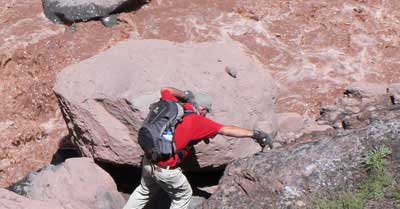 Martin scrambles along the river during his epic hike from Plaza de Mulas