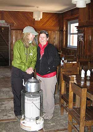 Kate and Leila warm up after a day of hiking