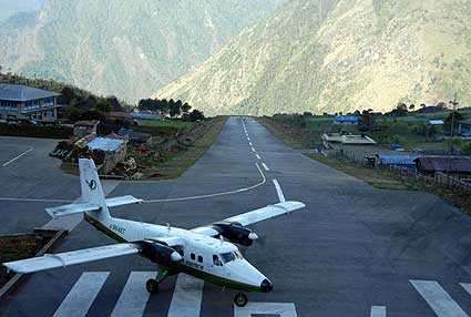 The Twin Otter lands on the small airstrip in Lukla