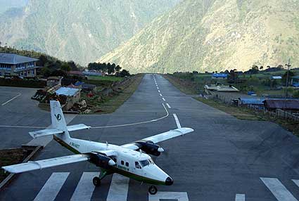 The Twin Otter lands on the small airstrip in Lukla
