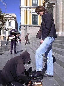 Julie steps up for a shoe shine in the streets of La Paz