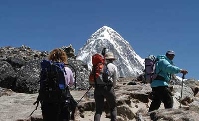 Trekkers with Pumori in the background