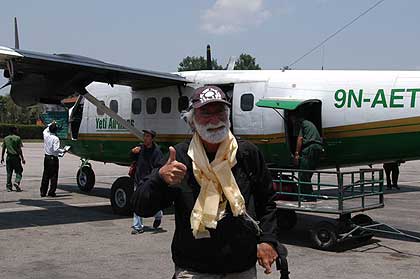 Wes disembarking from Yeti Airlines plane in Kathmandu