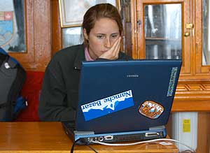 Katherine inside the khumbu lodge surfing on the Internet with Pemba’s laptop