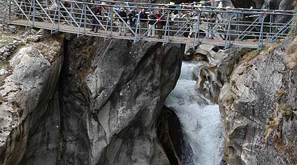 The group pauses on another Khumbu bridge