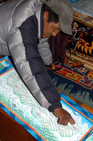 Pasang, who lost his fingers due to frostbite on a climbing expedition, now works as a tanka painter
