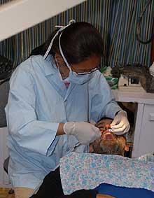 David has his tooth repaired in Namche