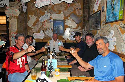 Friends enjoy a toast at the Rum Doodle