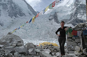 Fiona stands proudly beside the base camp chorten. Khumbu icefall in the background.