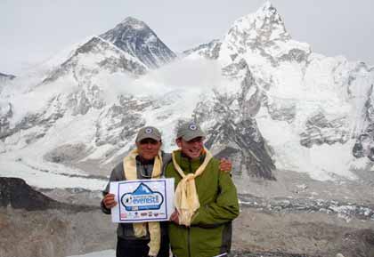 Wally and Jim with the Big Brother Big Sister sign on the top of Kala Patar 