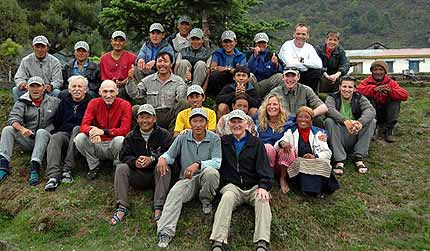 Our entire team sits together for a group photo in Phakding