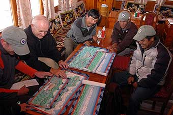 Ang Pasang Sherpa shares his paintings with the group
