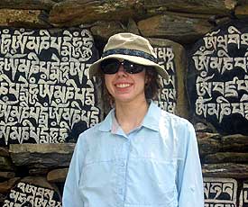 Libby in front of Mani stones on the trails