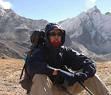 Steve relaxing on the trail to base camp and enjoying the mountain views