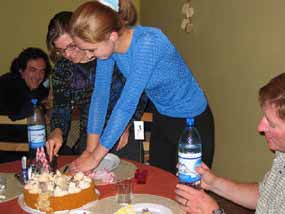 Gretchen and Olissa cutting the birthday cake