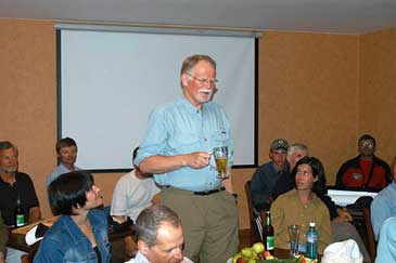 Woody shares his thoughts at the farewell dinner.