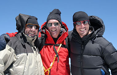 Rob, David and Adam from Eastern Canada smile on the summit of Elbrus