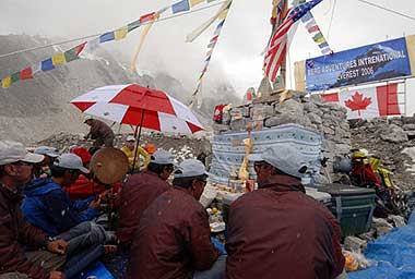 The team gathered around the chorten for Pooja day