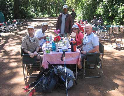 Pat, Joe, Dave and Safi enjoy a hearty lunch before they start up the mountain