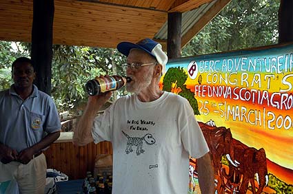Babu enjoys a cold beer at the end of the trail Notice what his shirt says!