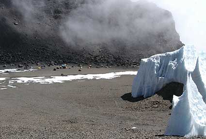 BAI campsite and the steep wall that the team descended to reach campsite