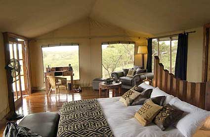 Sleeping with the sounds of hippos in the luxurious bed at the Migration camp