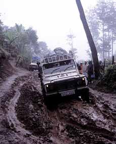Through the mud on the way to Machame gate