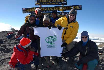 Dave and Linda at the summit with the sign that Dave brought from England 