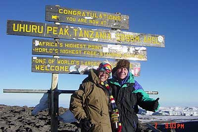 Cami & Brittany reach the summit of Kilimanjaro.