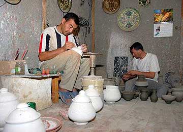Old friends of Berg Adventures: potters hard at work at the ceramics factory we visited