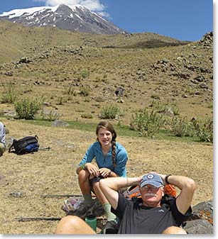 Granddaughter and grandfather team take a break while climbing Mount Ararat