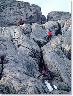 Climbing along fixed lines to the Summit of Carstensz Pyramid