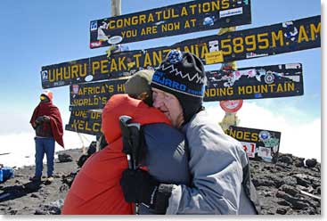 Emotional moment on the summit of kili with his daughter