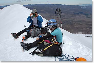 Climbers hydrating while enjoying the view from the summit of Chimborazo at 20,701ft/6,310m