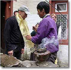 Climber receiving blessing in preparation for Ama Dablam