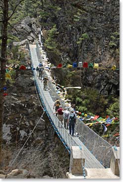 Crossing a suspension bridge on the trail