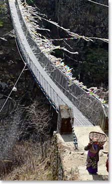 Crossing a suspension bridge between Namche and Phakding