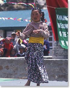 A Sherpa girl dances at a festival