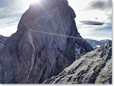 A thrilling Tyrolean traverse near the summit