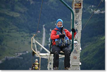 Riding up on chairlifts to the higher mountain trails