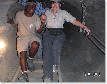 Simon, BAI Guide, Assisting Janet out of the mine