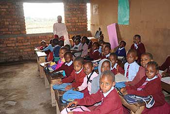 The children learning in their new classroom