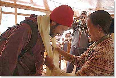 Thom receiving the traditional blessing