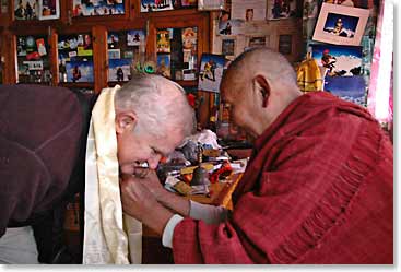 Doc (Charles) being blessed by Lama Gueshe