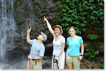 Donald, Mary Catherine and Deirdre are awed by the waterfall and lush terrain of our hike today