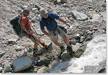 Alex and Steve making their way over the river