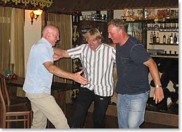 Paul, Klaus and Chad trying to imitate the dancers at the farewell dinner