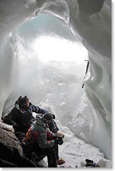 Wally and rescue team resting inside a vrevasse before returning outside to search for the lost climber