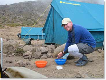 Ian washing up at camp