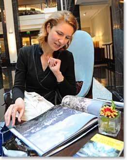 Lina looking through the wonderful photo book Alexandre (Elbrus 2007) made for her